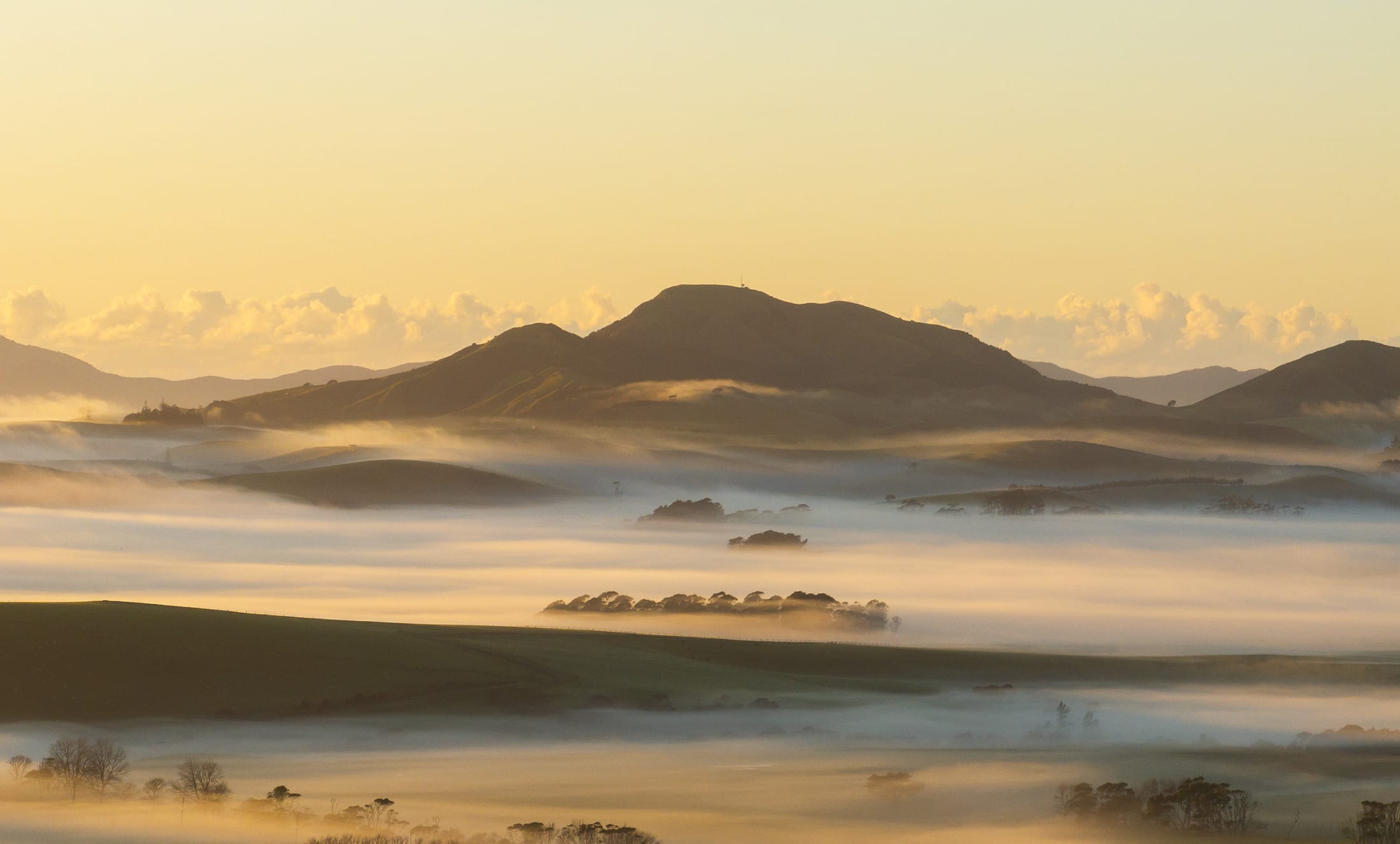 Golden mist rolling through Mataka Station's valleys at sunrise