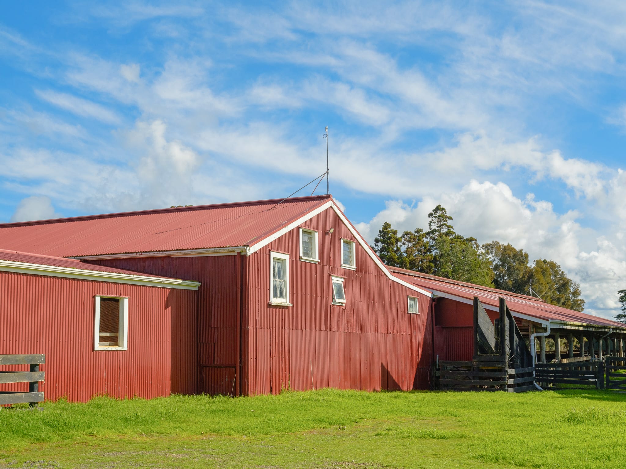 The red woolshed and stockyards on Mataka Station's pasture